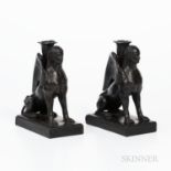 Pair of Wedgwood Black Basalt Seated Sphinx Candleholders, England, each modeled with a foliate mold