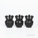 Three Wedgwood Black Basalt Figural Vases, England, 19th century, each with child seated between two