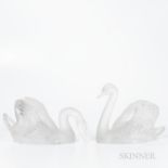 Pair of Lalique Swans, France, 20th century, frosted bodies, one with head raised, ht. 9 1/2, one wi