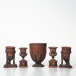 Five Wedgwood Rosso Antico Items, England, 19th century, each with black basalt relief, a pair of tr