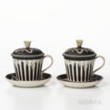 Two Wedgwood Black Jasper Dip Covered Cups and Saucers, England, 19th century, engine-turned stripin