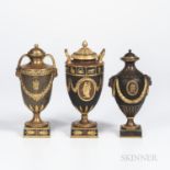 Three Wedgwood Gilded and Bronzed Black Basalt Vases with Covers, England, c. 1885, one with zodiac