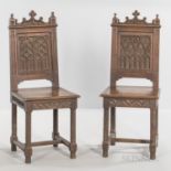 Six Gothic-style Oak Side Chairs, late 19th/early 20th century, each with a paneled back carved with
