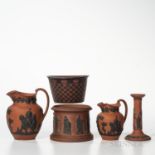 Six Rosso Antico Items, England, 19th century, each with black basalt relief, five marked Wedgwood,
