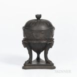 Wedgwood Black Basalt Tripod Vase and Cover, England, 19th century, domed cover with floral finial,