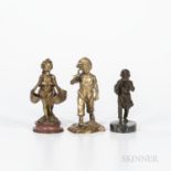Three Small Bronze Figures, a boy carrying a small cross over his shoulders by Antoine Bofill (Spani