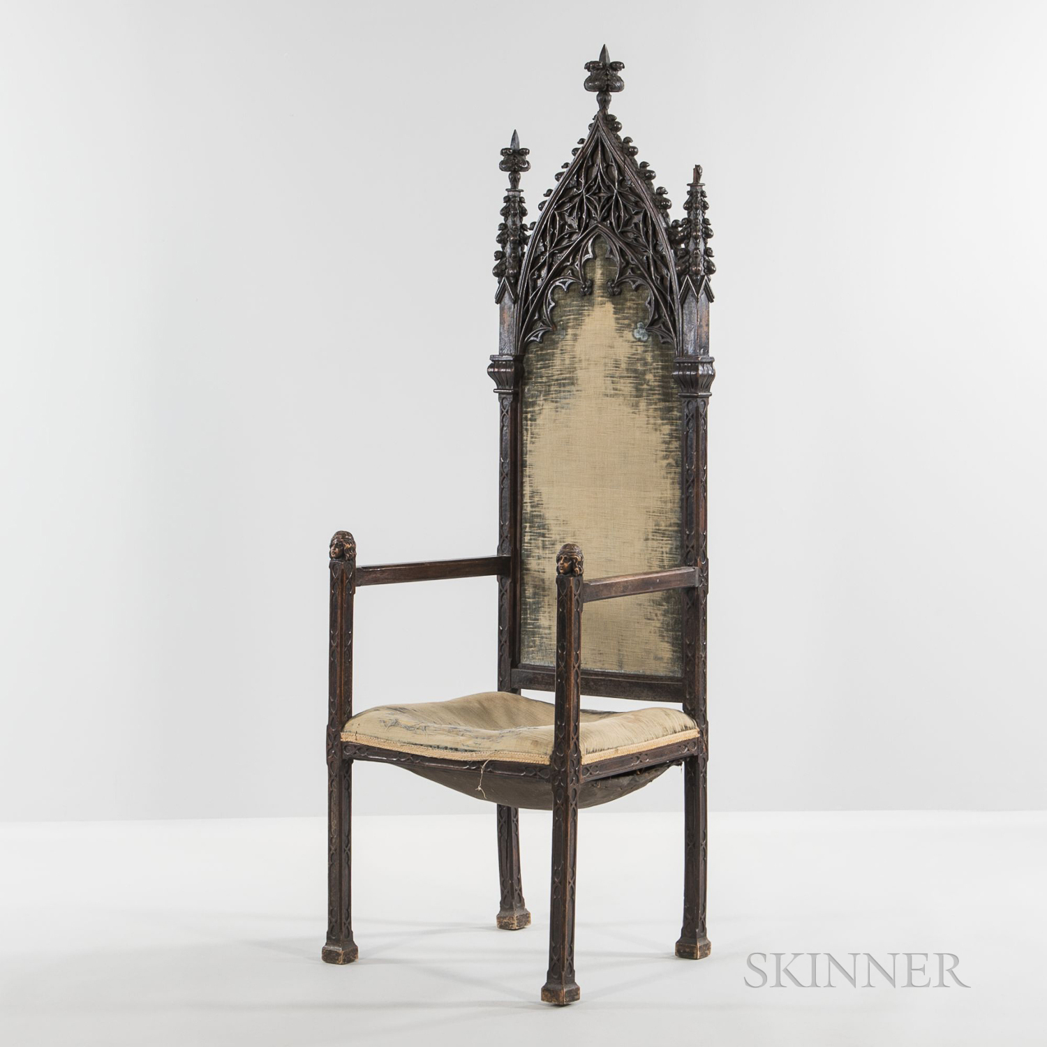 Gothic Revival Carved Armchair, 19th century, in the French style with carved tracery to seat back a