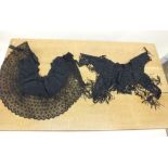 A Victorian black satin and lace cape and a small black sequinned shoulder cape