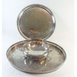 A silver plated oval tray, a silver plated circular tray and a silver plated circular dish