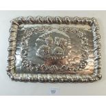 A silver plated dressing table tray with embossed cherub design