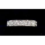 An 18 carat white gold half eternity ring set seven diamonds - size Q