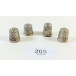 Three silver thimbles and one plated one