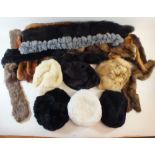 A selection of fur scarves, mufflers and hats