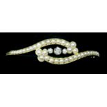 An 18 carat gold bangle set seed pearls and three diamonds - 9.6 grams (unmarked)