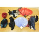 A feather hat, two feather fans a/f and various loose feathers etc