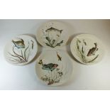 A set of four Johnson Bros fish plates