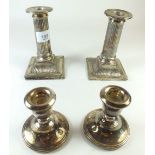 A pair of silver column form candlesticks - 13cm, and a small pair of squat silver candlesticks