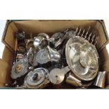 A box of silver plated items including teapots, milk jugs, warming plates etc