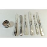 A box of seven items of various silver collared and some silver handled cutlery, together with a