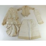A Victorian dolls cream silk dress and skirt with slip and knickers