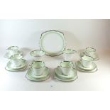 A Bell China Art Deco tea service with green and silvered banded decoration comprising: six cups and