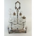 An Edwardian seven bottle cruet set on silver plated base - one bottle with modern stopper and one