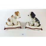 A pair of dog on cushion ornaments - a spaniel and a fox terrier 12cm