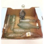 A group of seven glass bottles including Arnold Perrett & Co, Rawlings etc and a glass babies