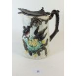 A large Victorian Majolica jug decorated nesting birds - pewter lid a/f