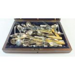 A box of assorted silver plated sugar castor spoons, pickle forks, preserve spoons etc