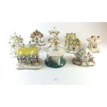 A collection of twelve Coalport porcelain cottage pastille burners