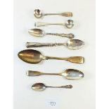 A collection of silver spoons and cruet spoons