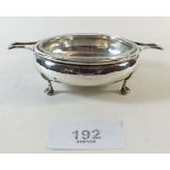 A small circular silver butter dish with glass liner, Birmingham 1928, 57g