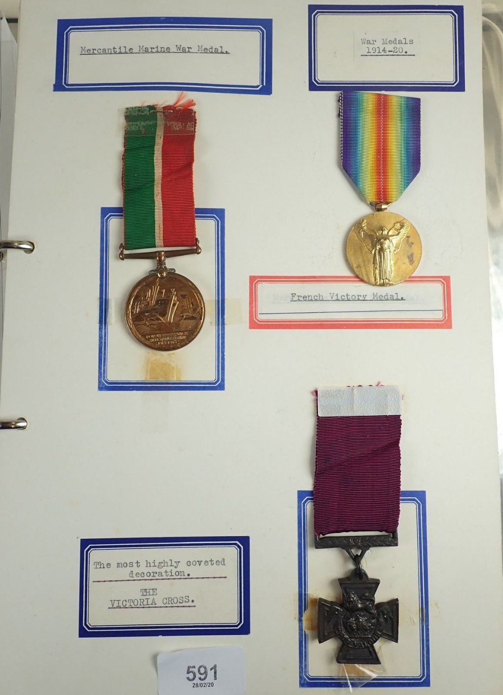 A folder of various war and other medals, mounted on card and taped over front. Including: 1914