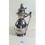 A silver plated maple syrup jug