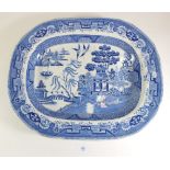 A Victorian willow pattern meat plate with gravy well