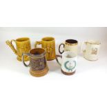 A collection of sporting pottery tankards including cricket, golf and football