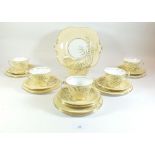 An Aynsley tea service comprising cake plate, six tea plates, five cups and saucers, milk and