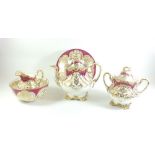 A 19th century Rockingham style teapot, sugar, jug, slop bowl and plate, all with gilt decoration