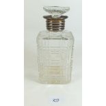 A silver mounted cut glass decanter and stopper