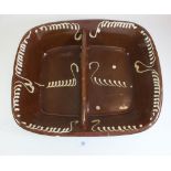 A large slipware oven dish - 40cm wide