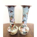 A pair of Japanese large early 20th century long necked vases painted flowers on turquoise and