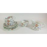 A Minton Haddon Hall set of two cups and saucers, milk and sugar