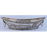 A silver oval pierced basket with mask and ring handles and embossed swag decoration - 458g by