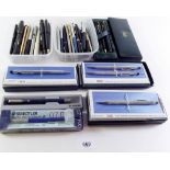 A large quantity of pens, fountain pens and pencils including Parker, Cross, Eversharp etc