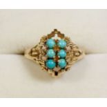 A gold ring (unmarked) set turquoise, size L