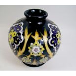 A squat Moorcroft vase in the Florian Daisy pattern - 10.25 cm tall.