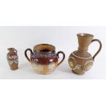 A Royal Doulton stoneware pot with silver rim and two Silicon Ware jugs