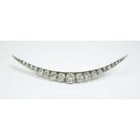 A Victorian large silver and gold backed crescent brooch set nineteen graduated diamonds - 7.2g