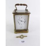 A French brass cased carriage clock by Brevete striking on a gong - with key - 13cm